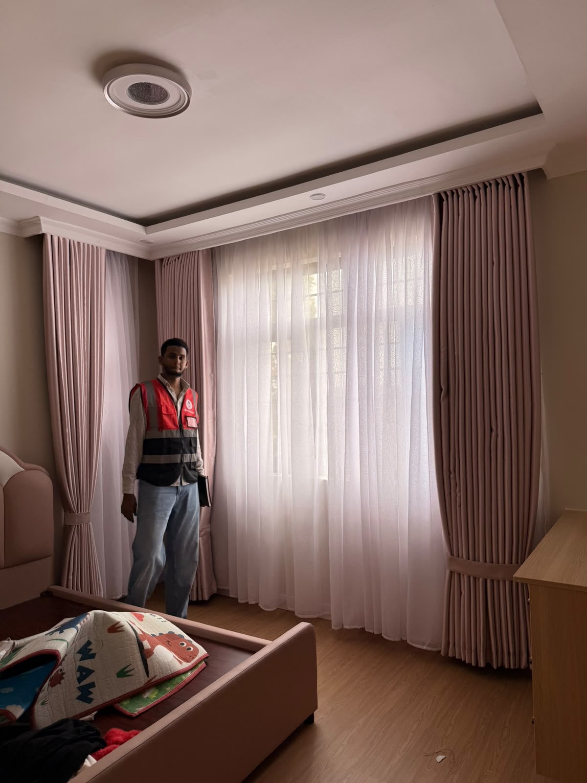 Professional curtain fitting in modern bedroom Nairobi Kenya